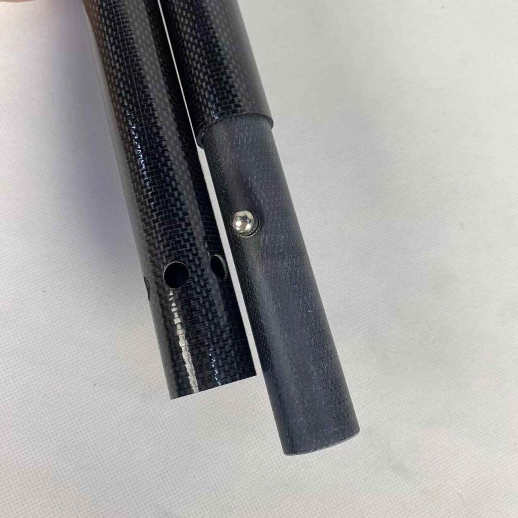 Carbon-telescopic-tube-spine-button