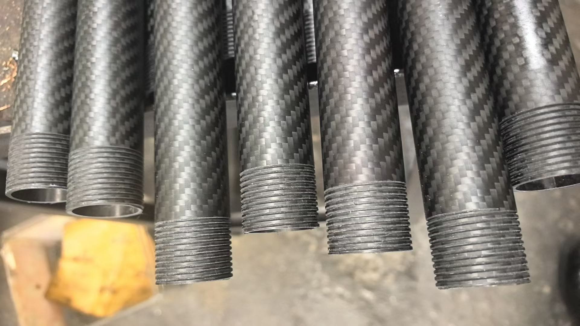 carbon fiber tube connectors joining round and square tubes in a drone frame