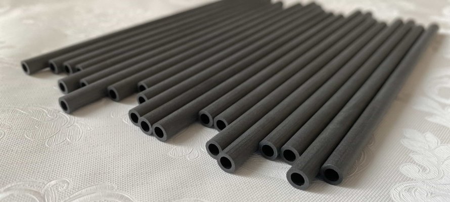 alt="before and after comparison of client’s failed part vs carbon fiber solution"