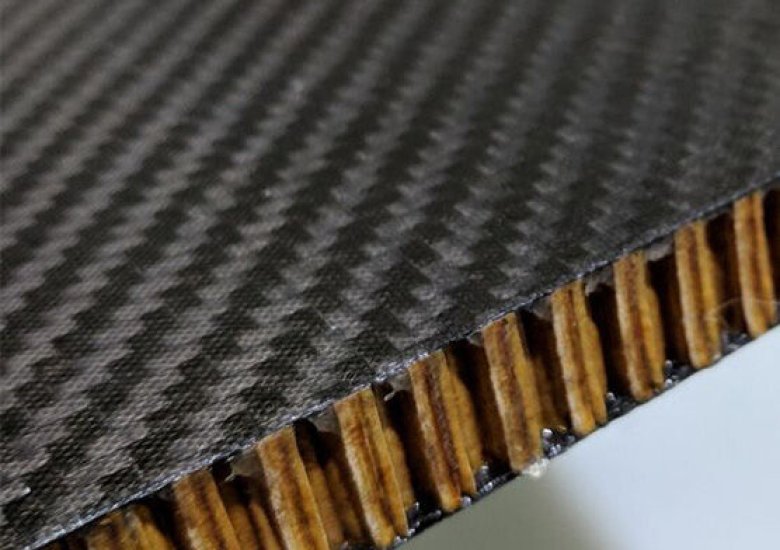 alt="Transparent carbon fiber panel with optical clarity"