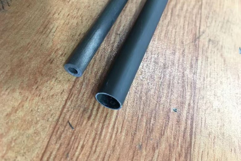 alt="custom carbon fiber tube integrated into client’s mechanical assembly"